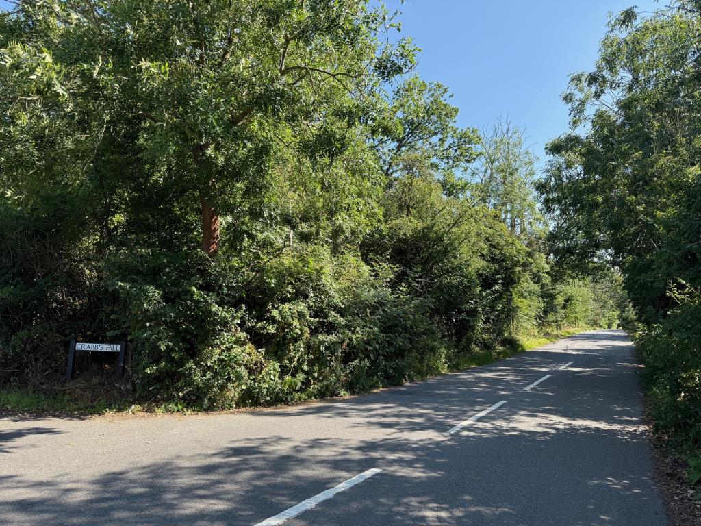 Lot: 27 - APPROX THREE ACRES OF FREEHOLD LAND - View looking down Crabbs Hill from the junction